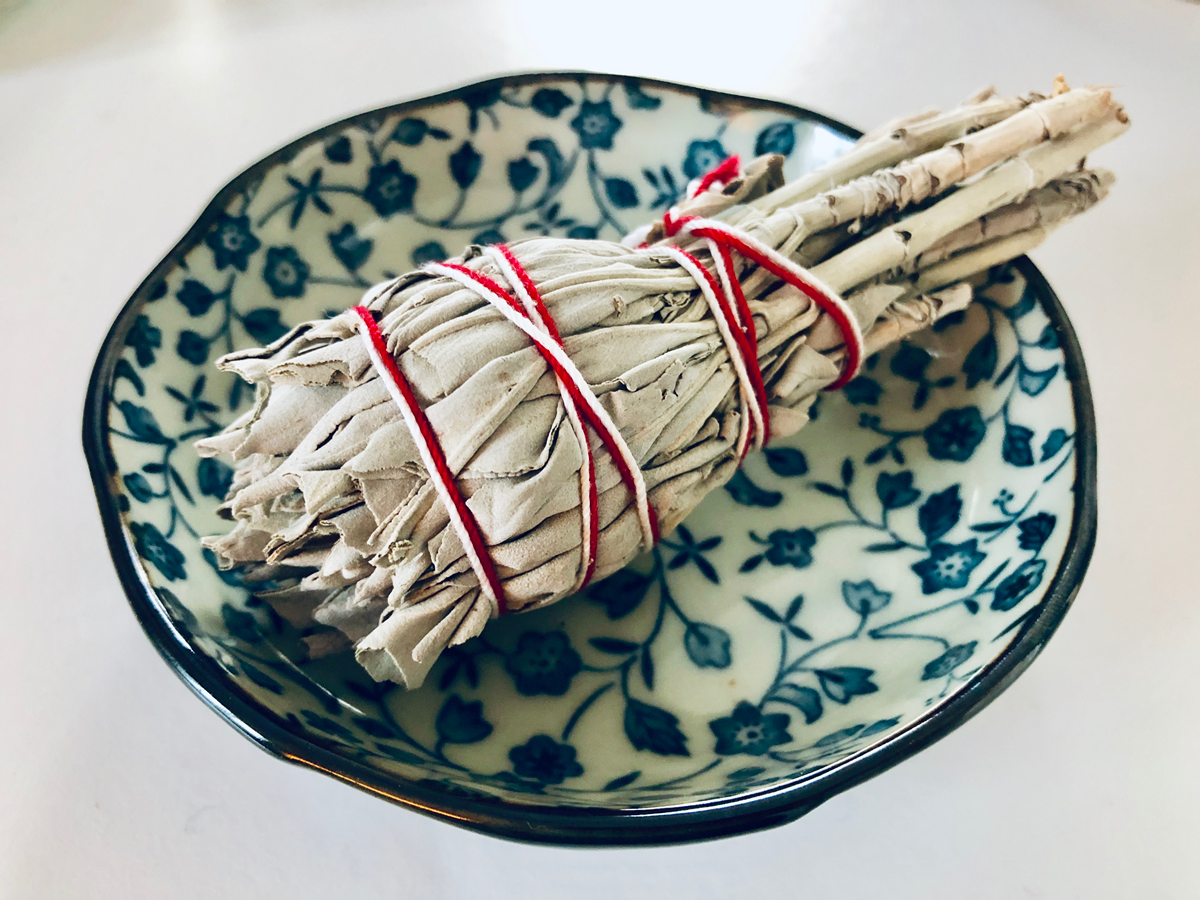 white sage torch in bowl