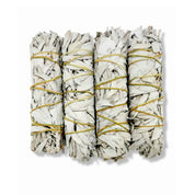 Four white sage smudge sticks bound with natural twine for cleansing rituals