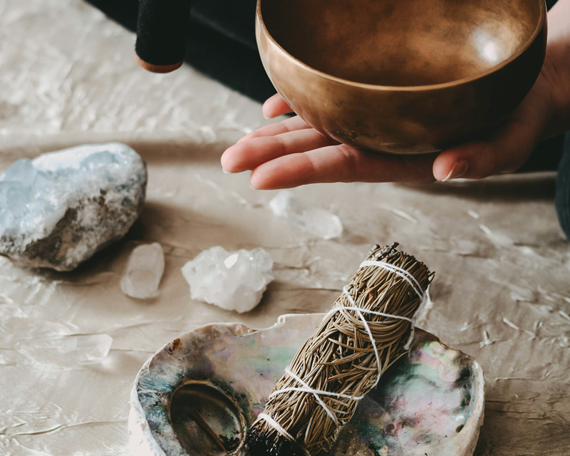 smudge stick in abalone shell bowl and singing bowl