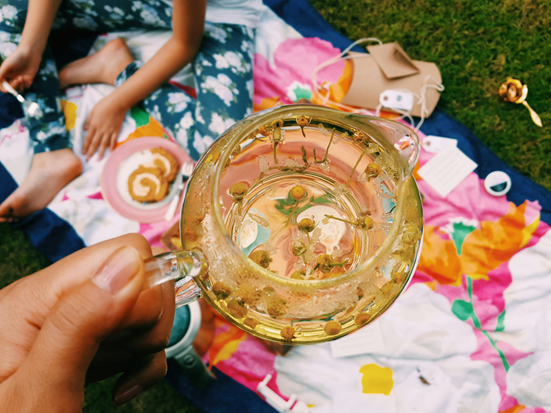 chamomile tea steeping in small glass jug