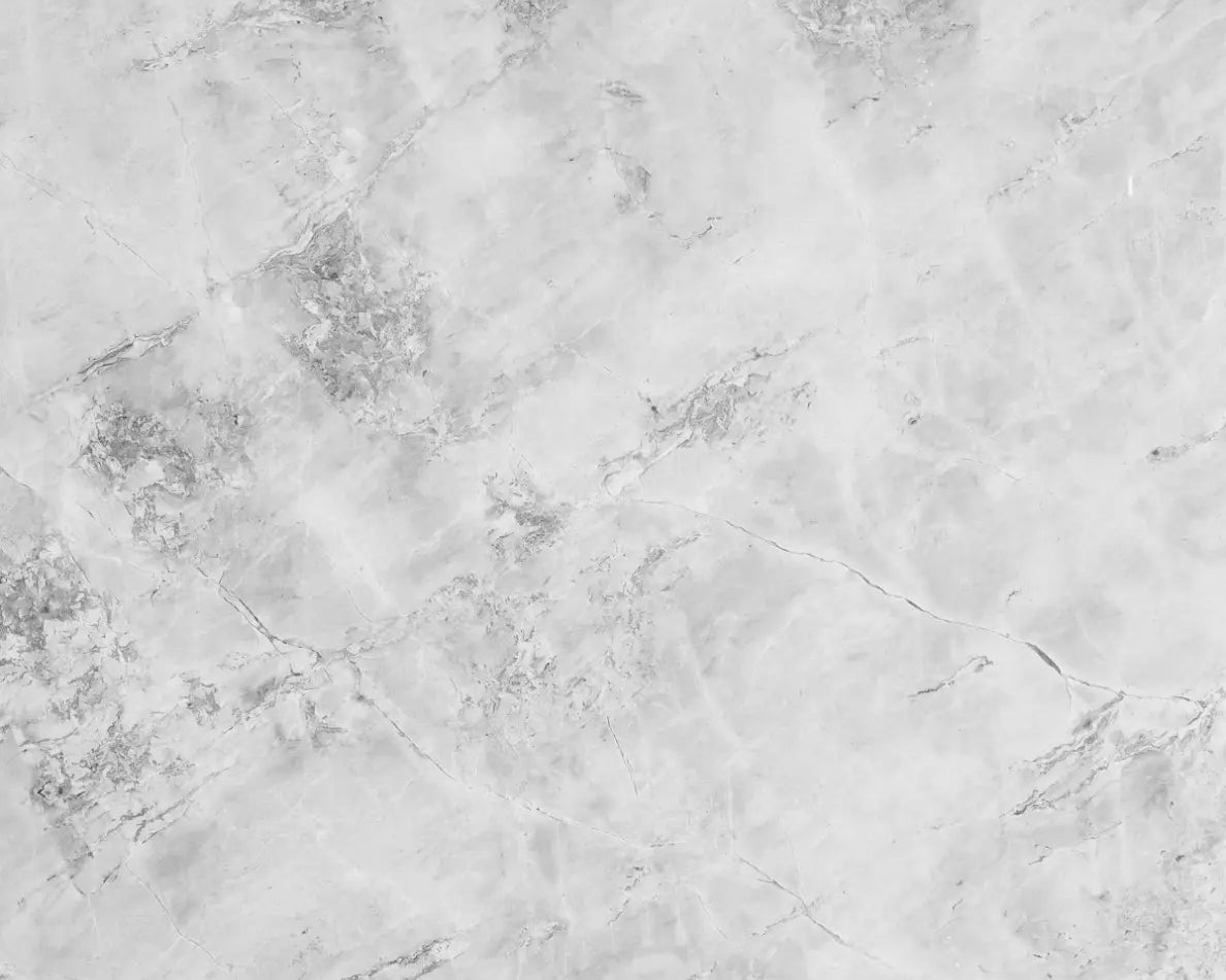 a black and white photo of a marble surface