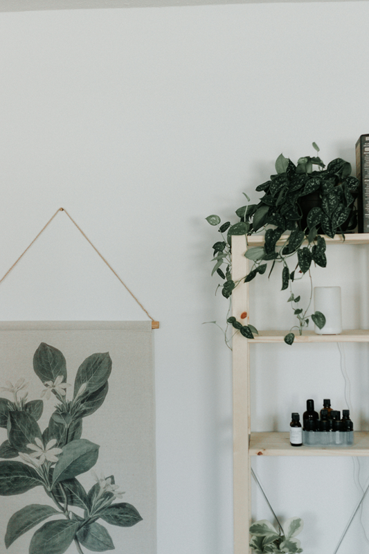 shelf with oils and diffuser