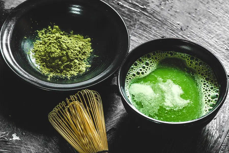 matcha powder in bowl with whisk