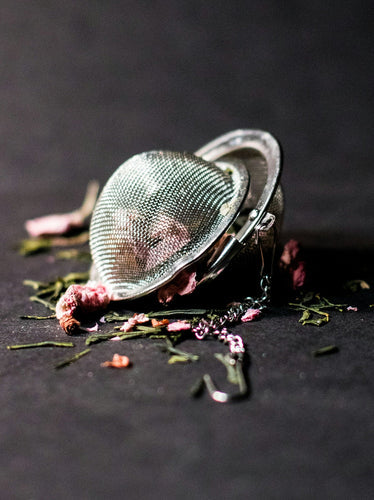 loose lea herbs in tea strainer