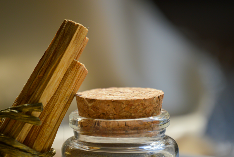 palo santo sticks leaning on jar lid