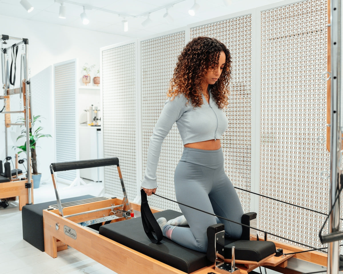 a woman on a treadmill in a gym