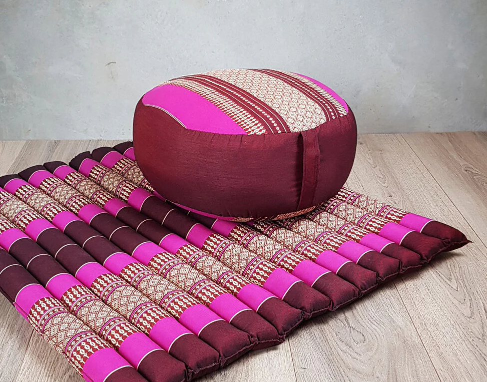 pink zafu meditation cushion on zabuton