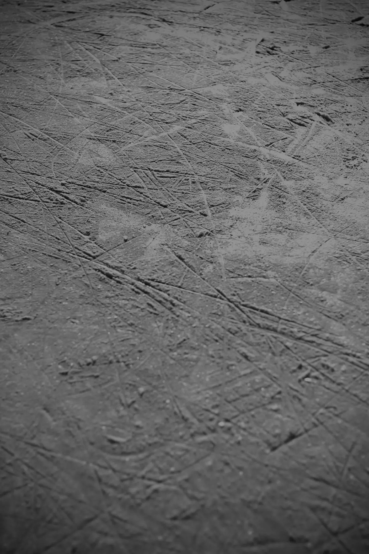 a black and white photo of a hockey rink