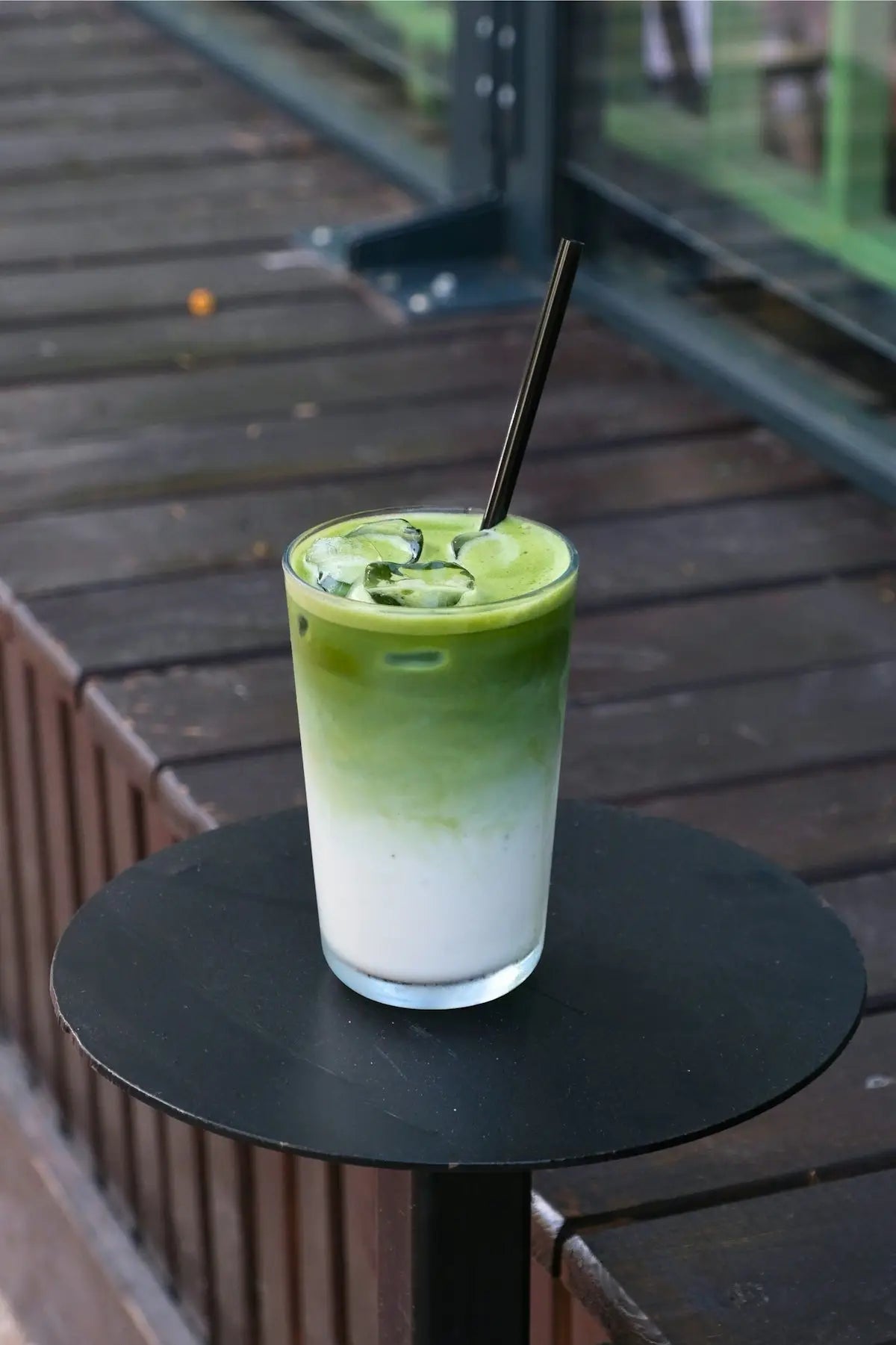 Here is a single-sentence caption for the image: matcha latte with an ombre effect.
