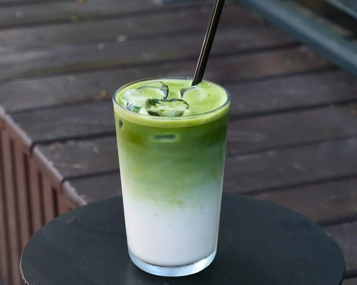 Here is a single-sentence caption for the image: matcha latte with an ombre effect.