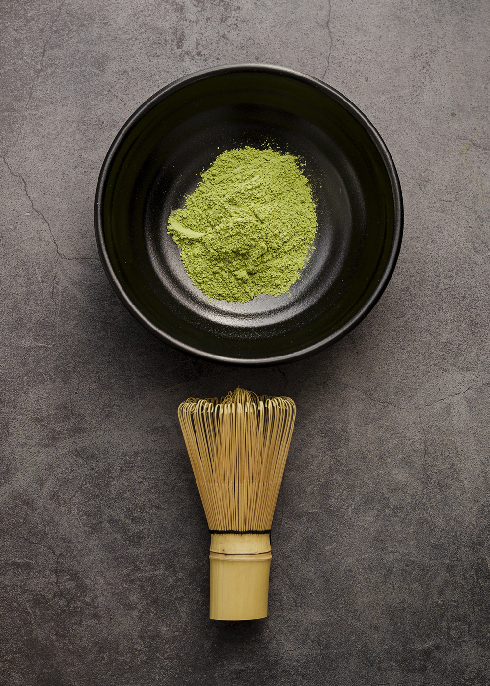 matcha powder in bowl with whisk