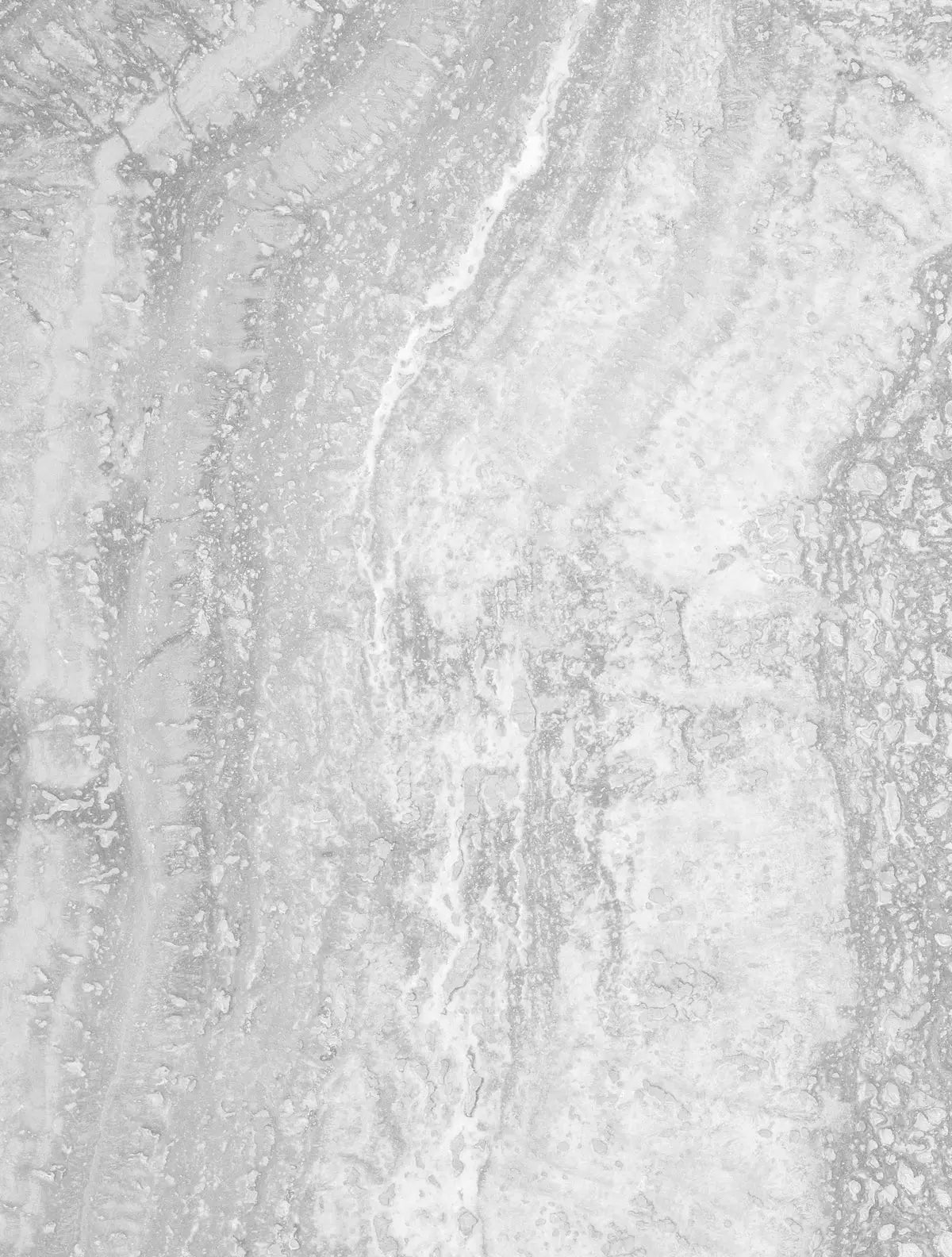 a black and white photo of snow and ice