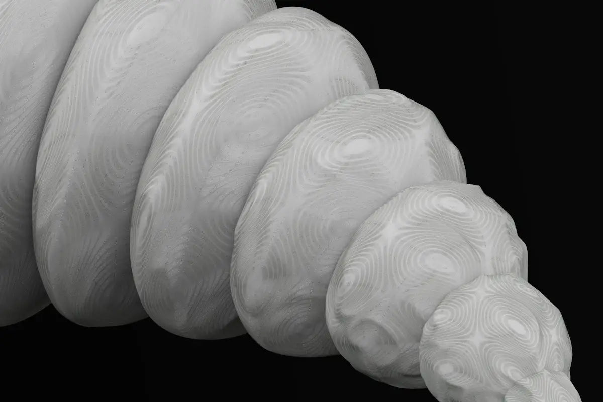 a close up of a white object on a black background