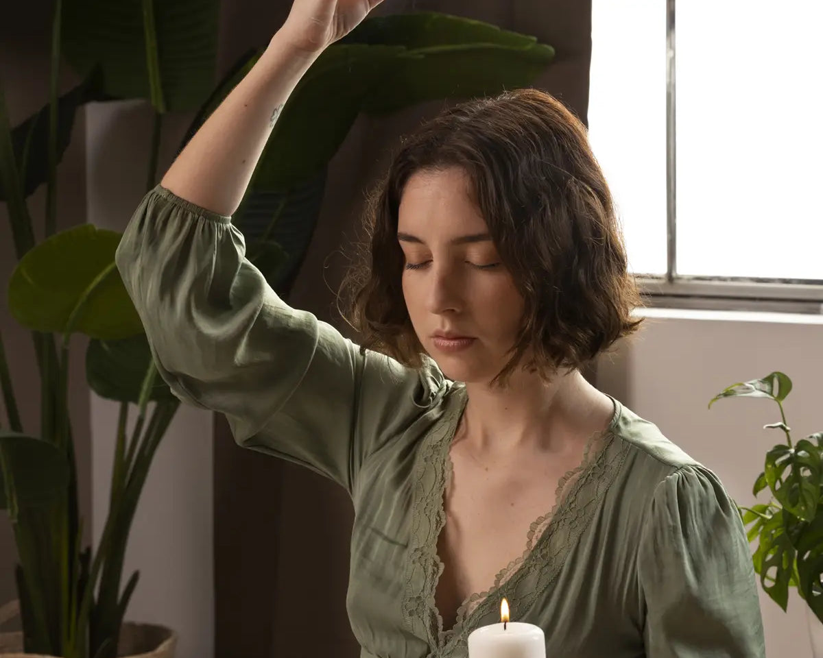 woman smoke cleansing with palo santo