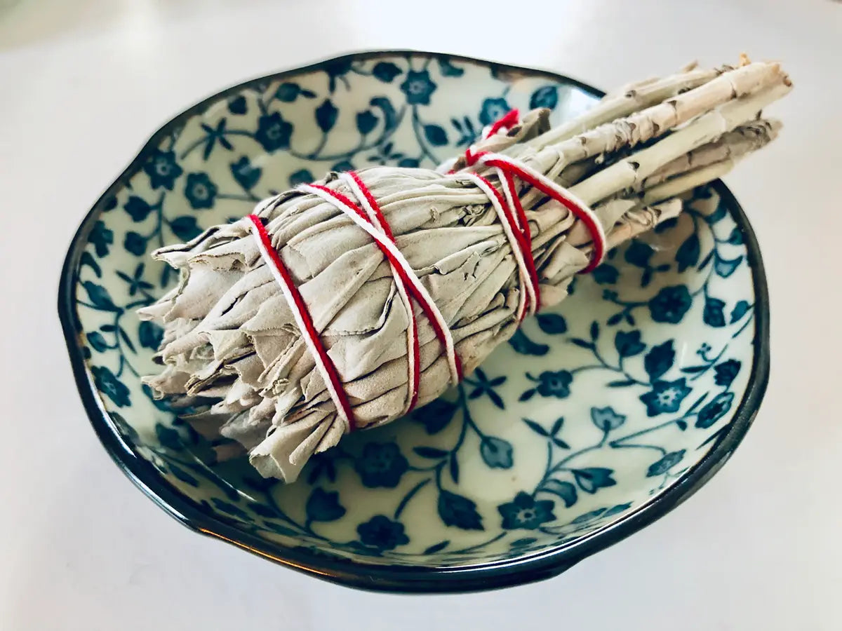 white sage torch in bowl