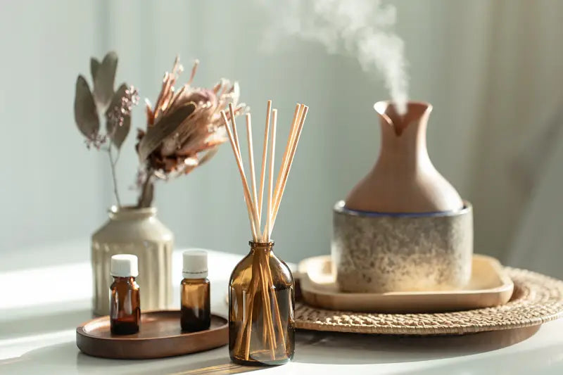 essential oil diffuser with oils and home decor