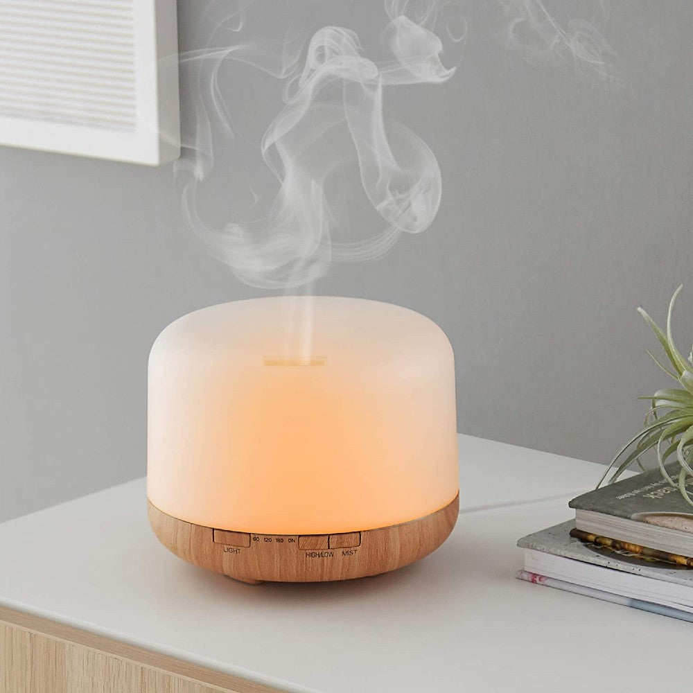 white essential oil diffuser on benchtop