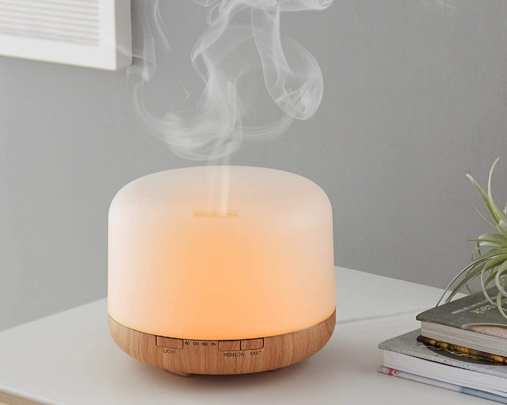 white essential oil diffuser on benchtop