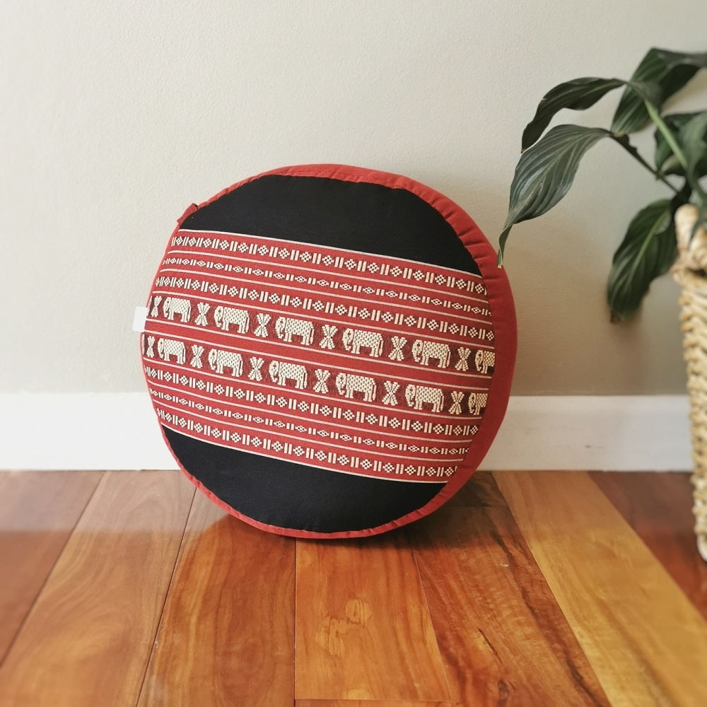 red and black round meditation cushion with elephant print