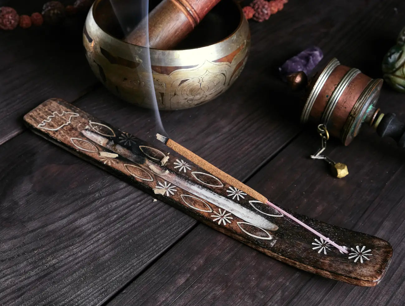 burning incense stick in holder
