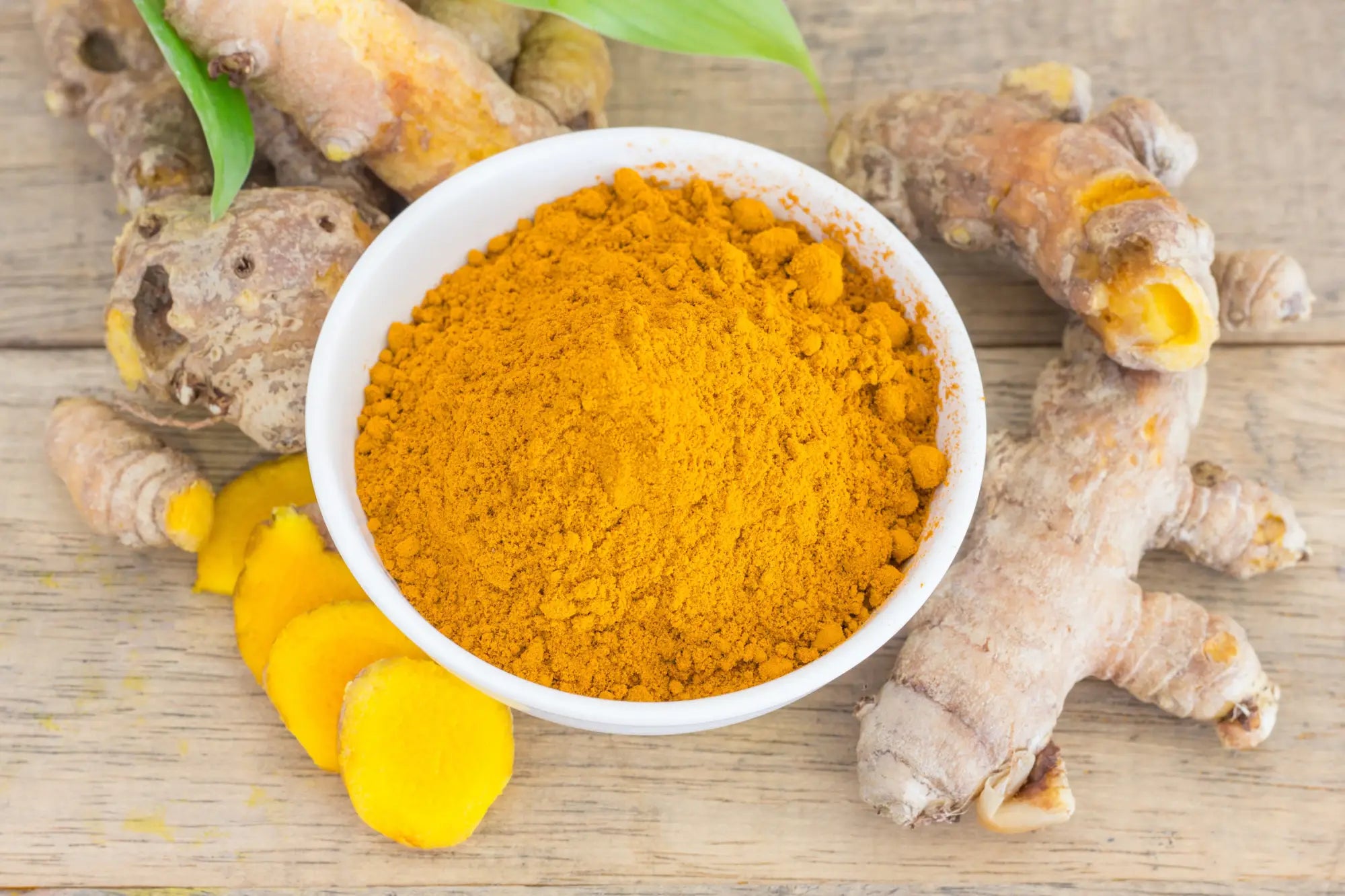 turmeric powder supplement in bowl