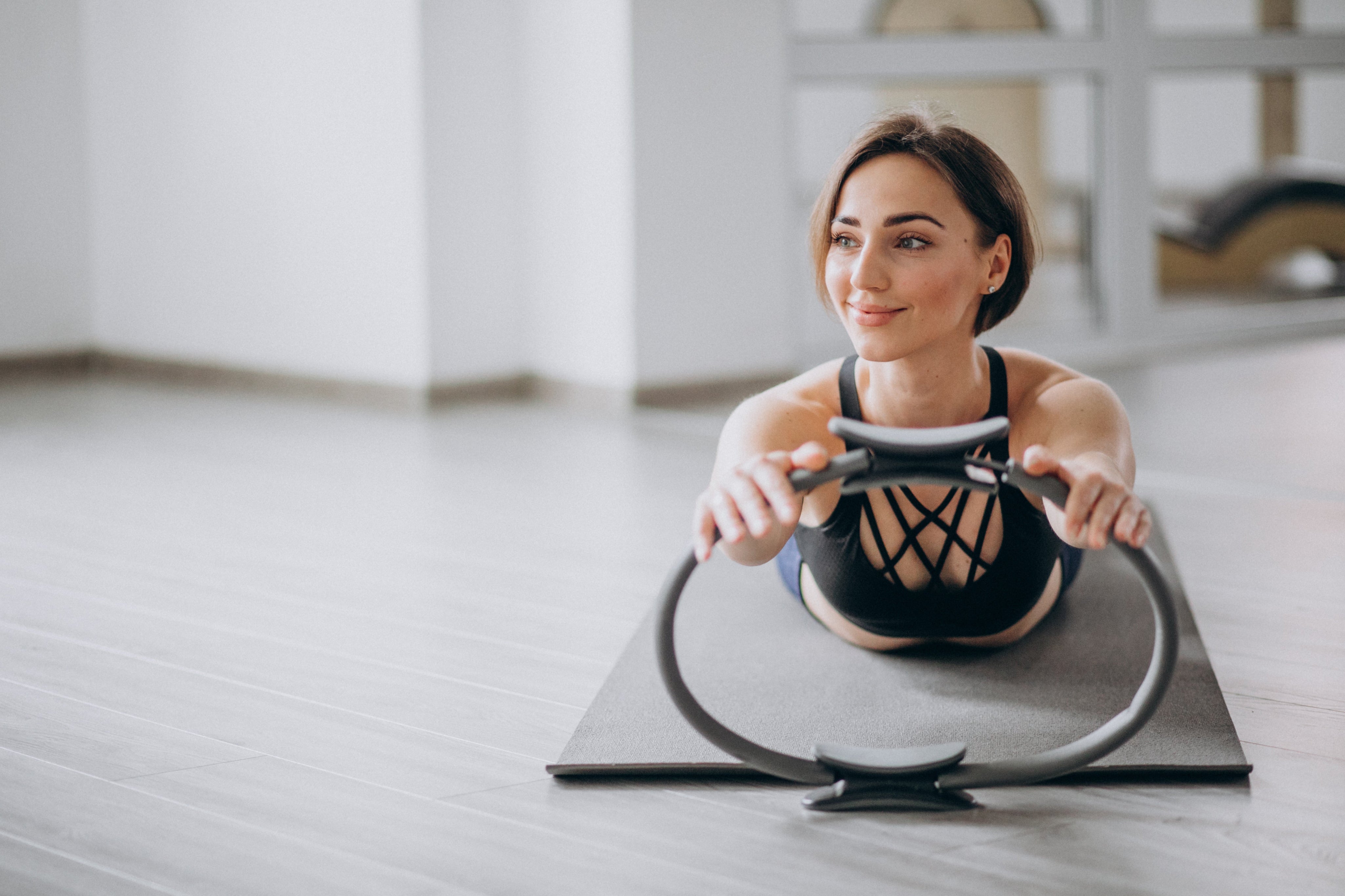 woman using pilates ring