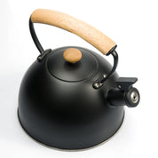 Matte black whistling tea kettle with wooden handle in a modern stainless steel design