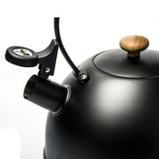 Matte Black Whistling Tea Kettle with Wooden Lid and Curved Spout for Modern Kitchen