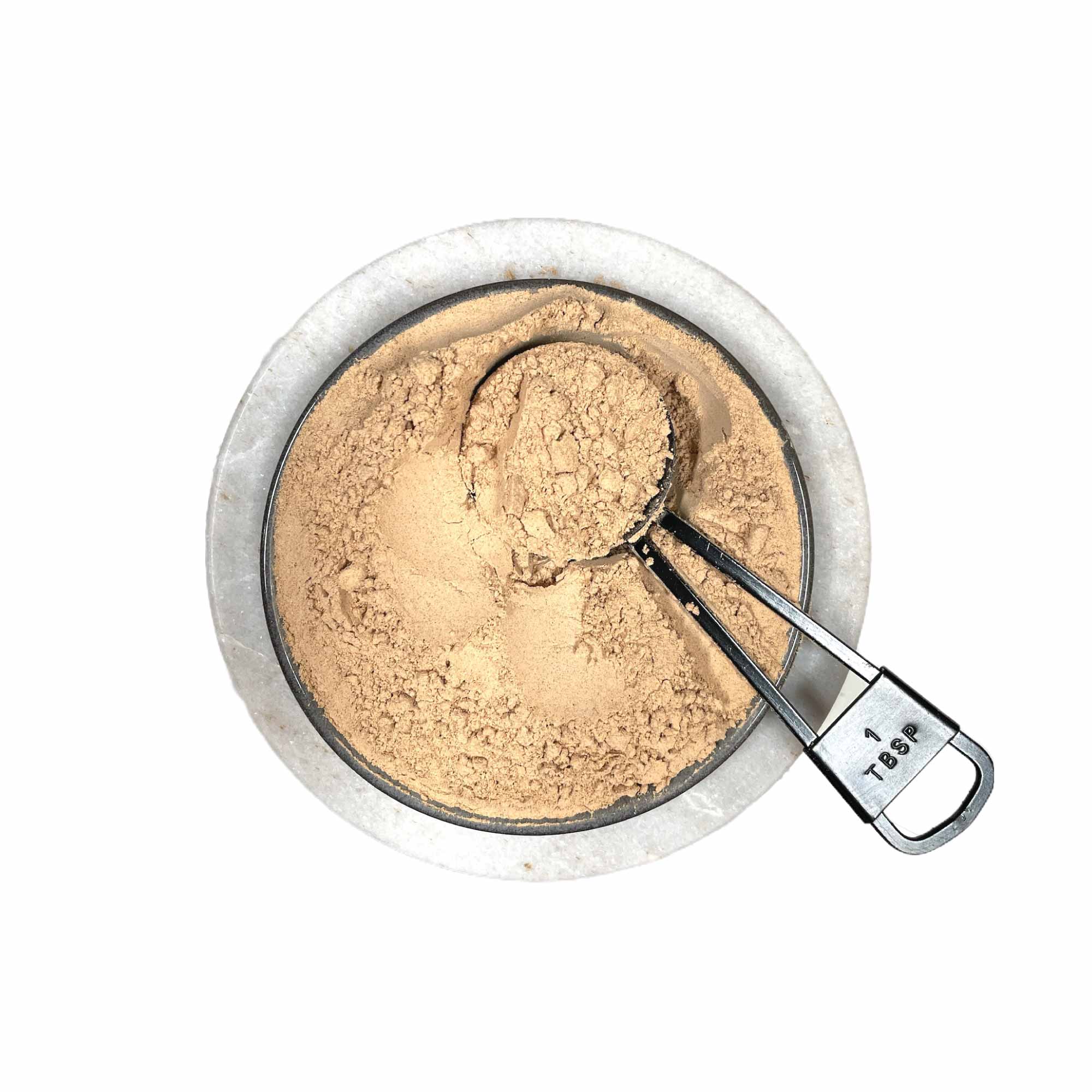 Bowl of organic maca powder with measuring scoop for super food Peruvian nutrition