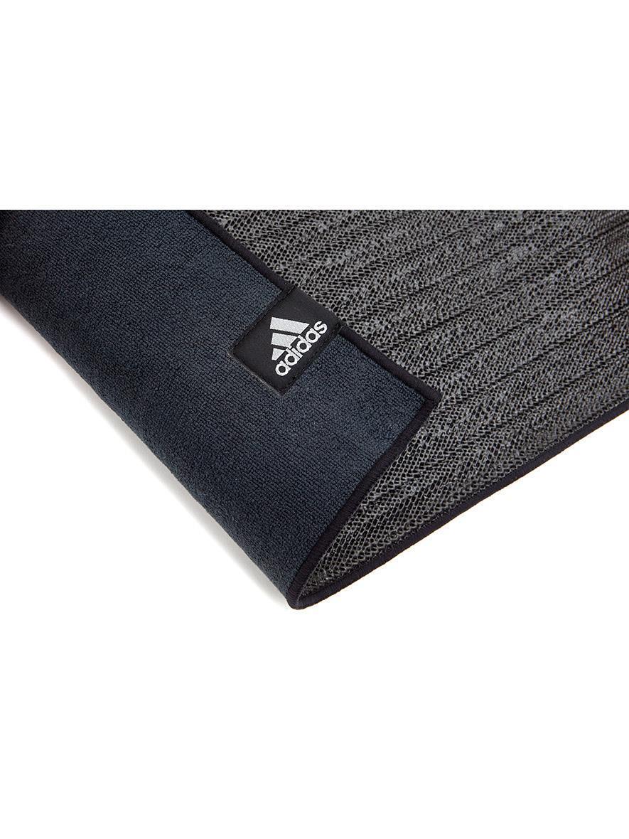 Black Adidas yoga mat with textured surface, ideal for hot yoga and Pilates with non-slip base