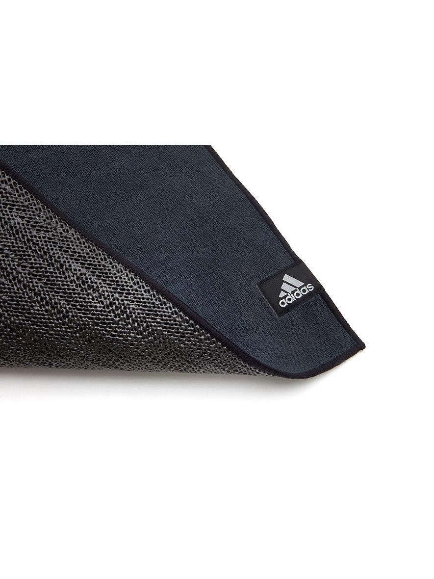 Black Adidas Bikram Yoga Mat with textured surface and webbed non-slip base