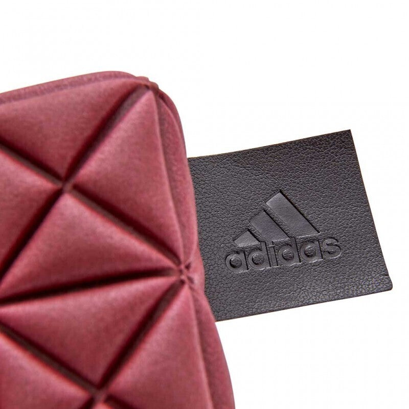 Pink geometric textured material with Adidas tag on Eco Yoga Block for enviro friendly home fitness