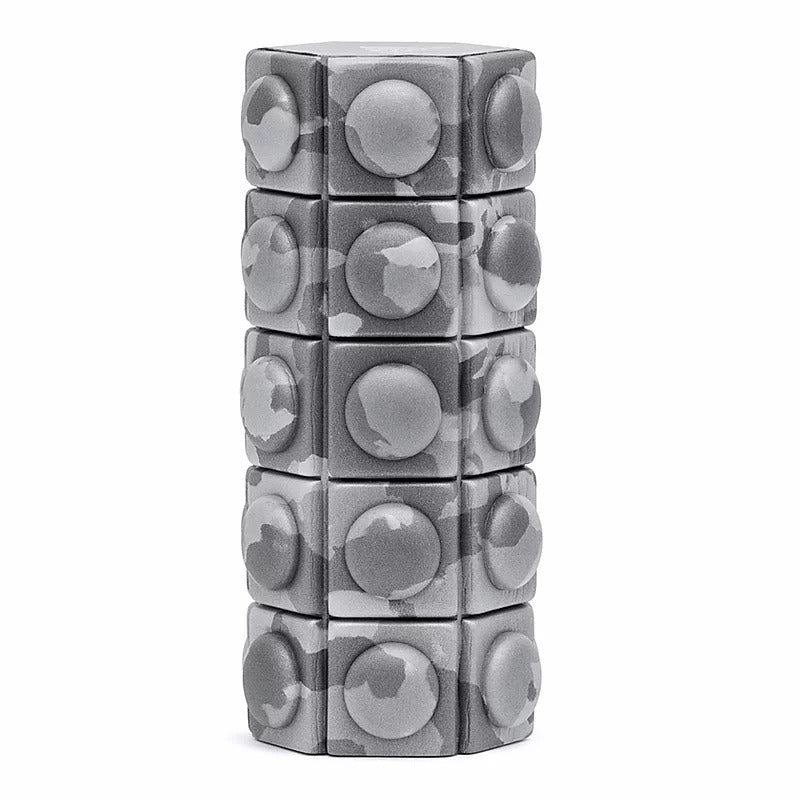 Stacked cylindrical puzzle toy with circular patterns on Adidas Mini Textured Foam Roller