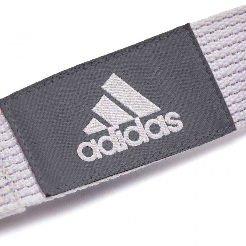 Grey Adidas logo patch on a white fabric strap of a Premium Yoga Strap adjustable belt Pilates