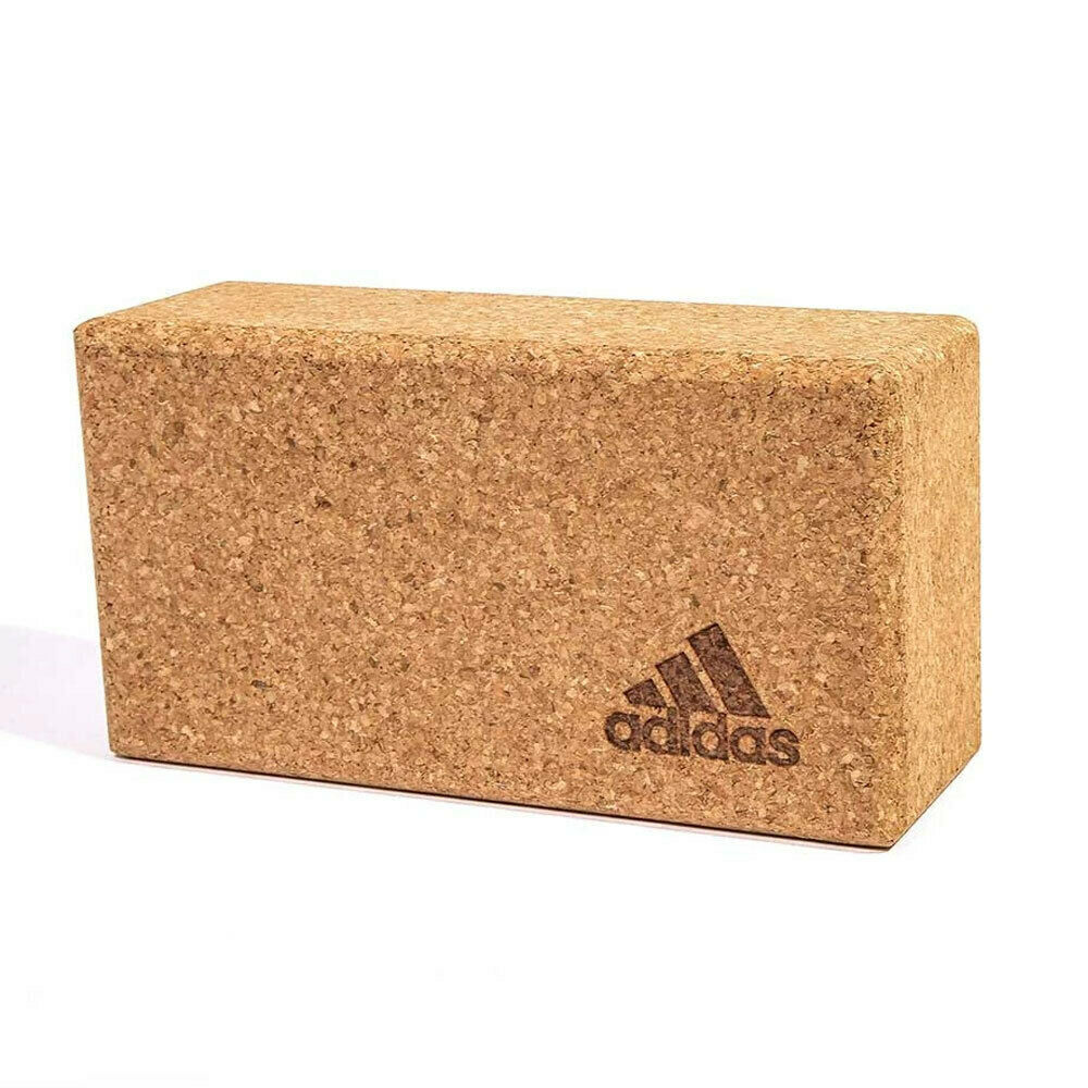 Adidas cork yoga block featuring logo, perfect for home gym fitness and Pilates