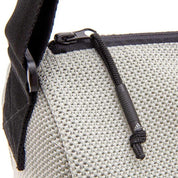 Close-up of zipper pull on Adidas Yoga Mat Carrier Bag with gray mesh fabric