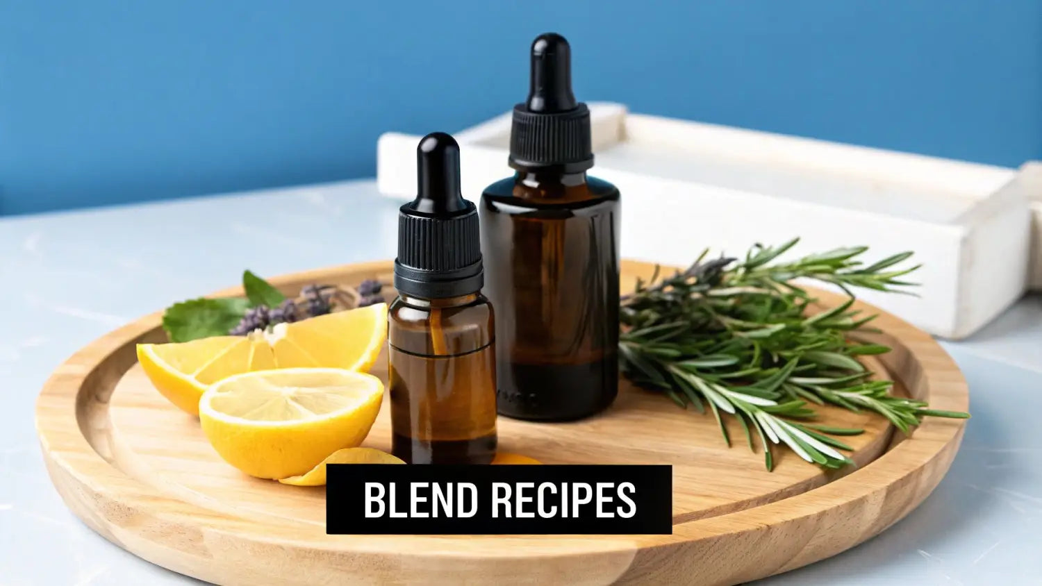 Amber essential oil bottles with fresh lemon, rosemary, and lavender on a wooden tray.