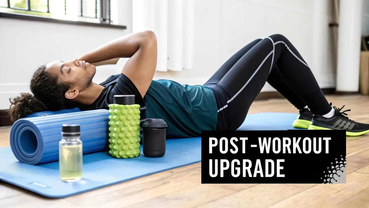A man rests on a blue yoga mat with a foam roller, shaker bottle, and supplement, emphasizing post-workout recovery.