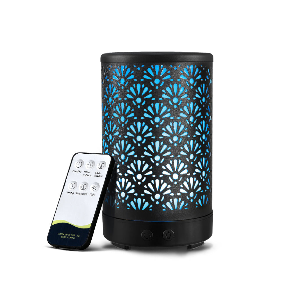 Black Devanti Aroma Diffuser with fan pattern, blue glow, and whisper-quiet operation