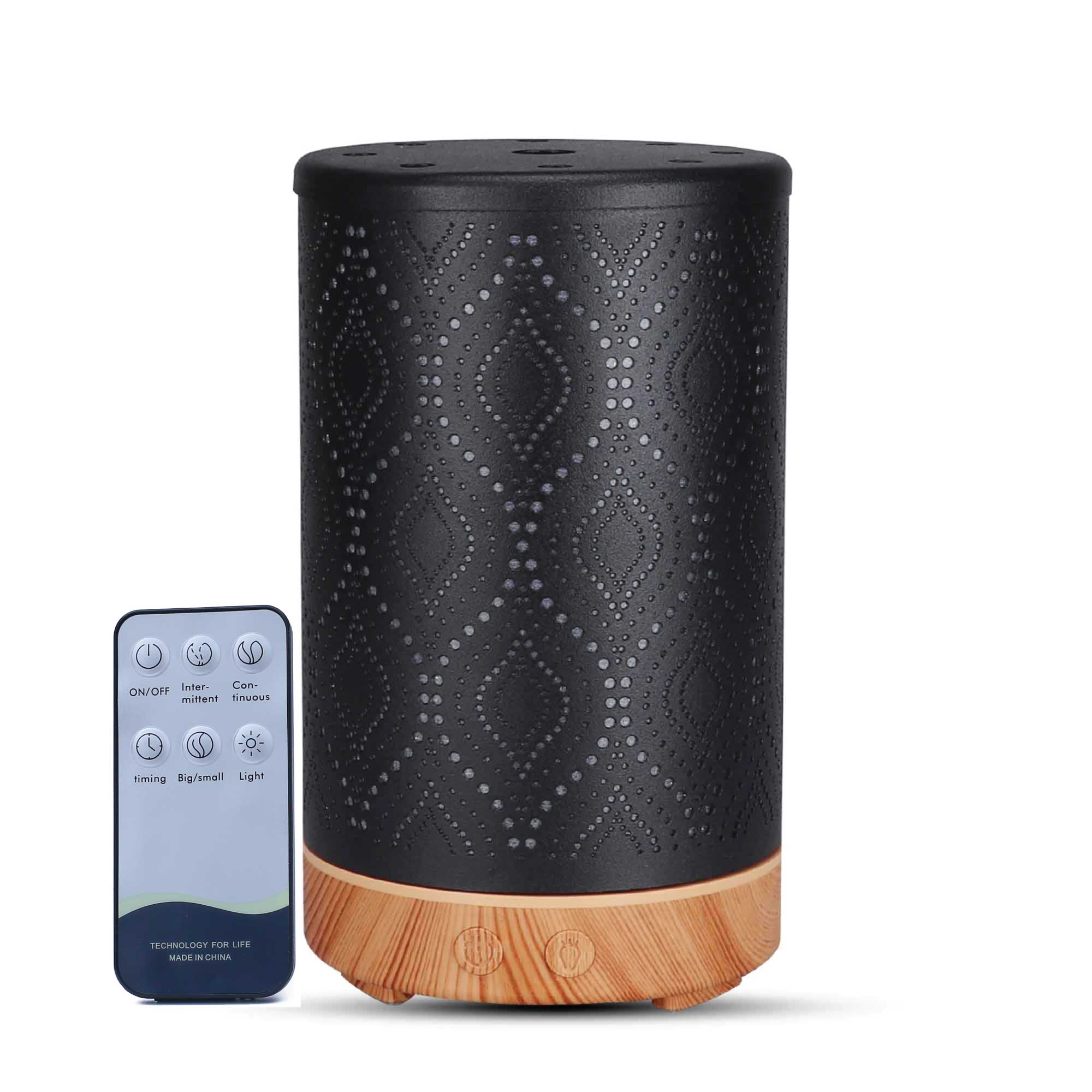 Black metal diffuser with diamond pattern, wood grain base, and remote for essential oils