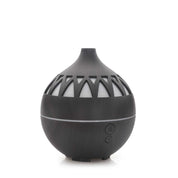 Black spherical oil aroma diffuser with decorative cutouts for dark wood mist and LED