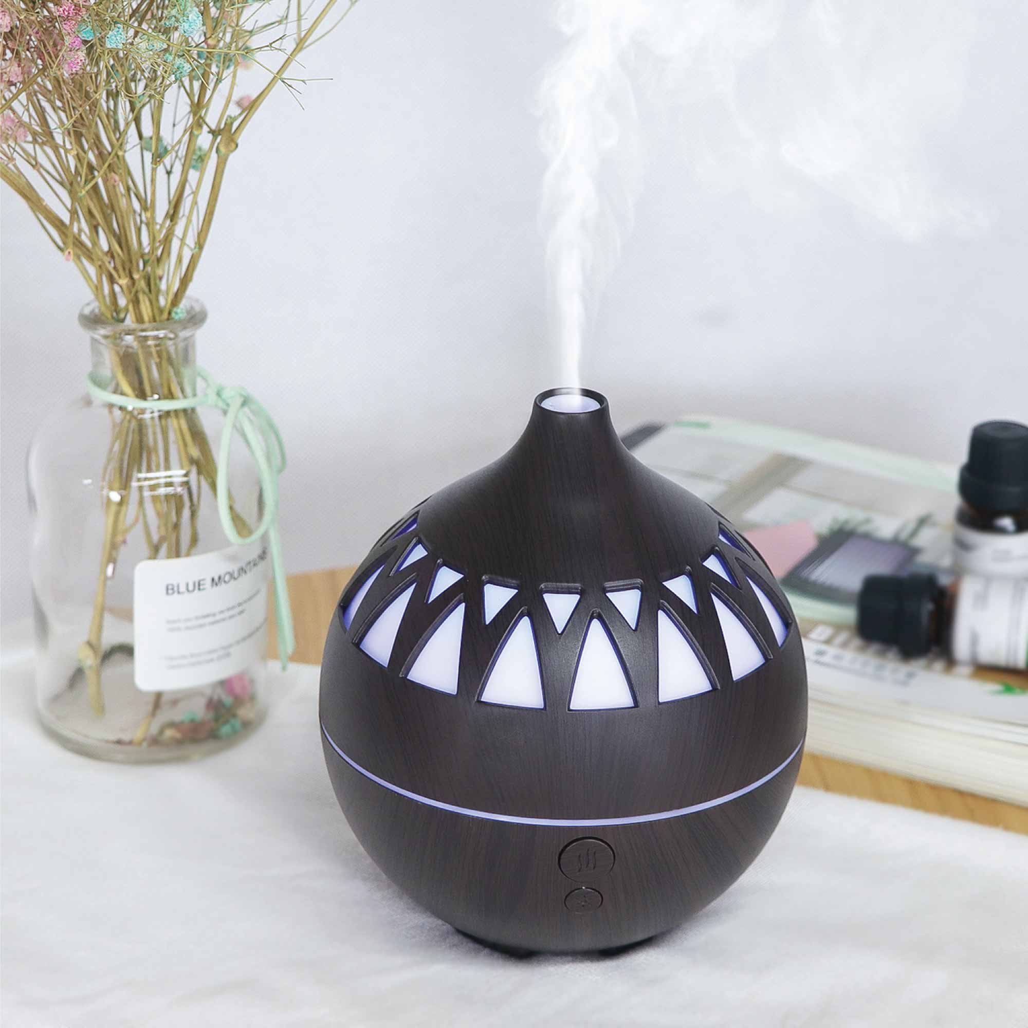 Dark wood mist essential oil aroma diffuser with triangular pattern and mist output