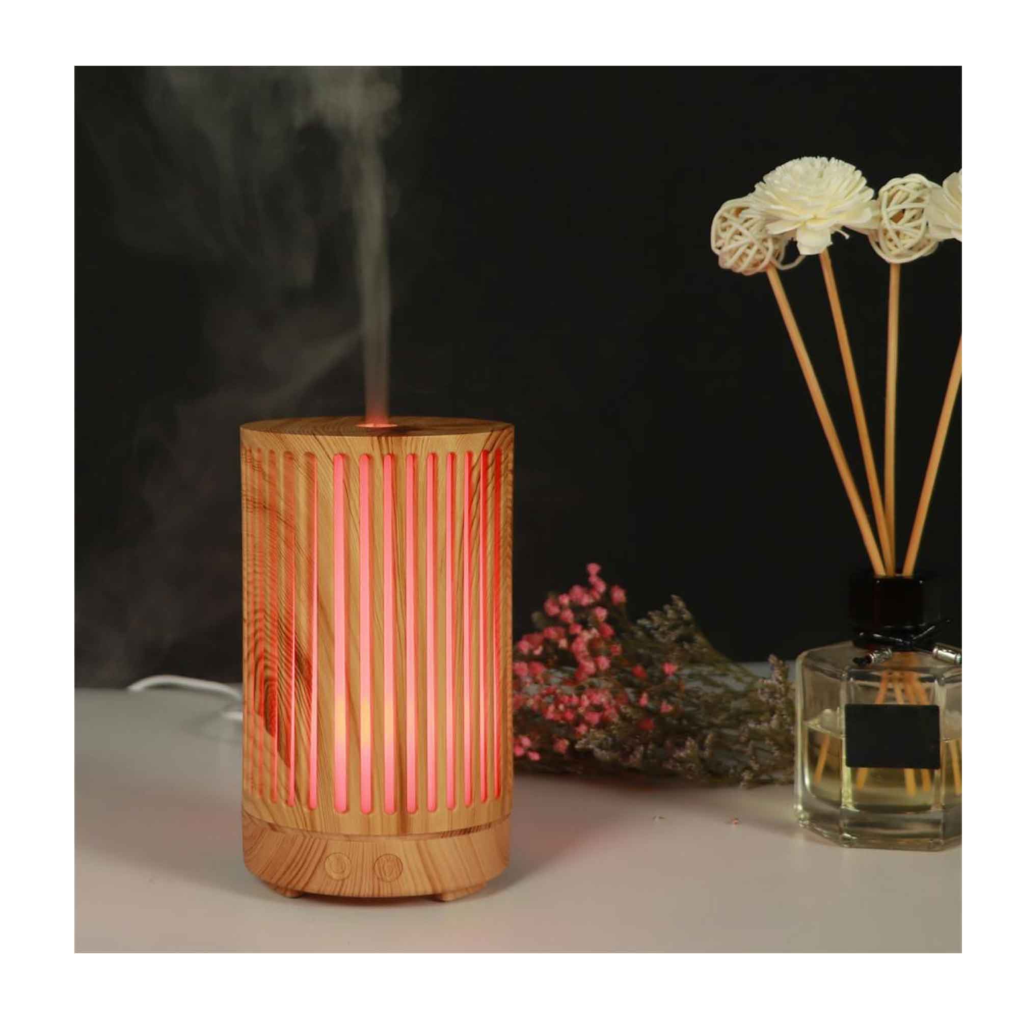 Glowing ultrasonic aroma diffuser with pink stripes and light wood grain design