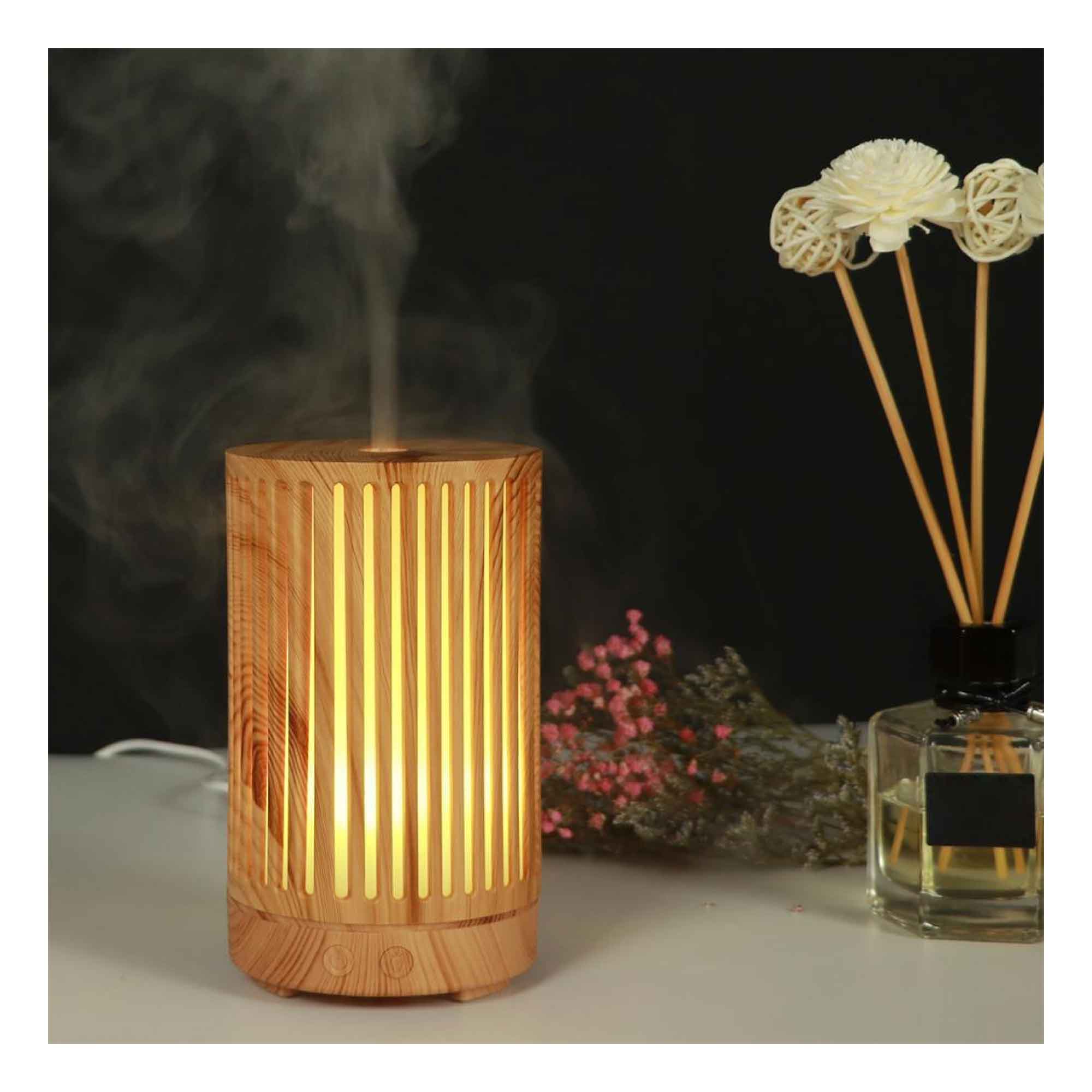 Glowing light wood grain ultrasonic aroma diffuser emitting steam and color changing light