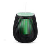 Black ribbed essential oil aroma diffuser with green light in vertical slats