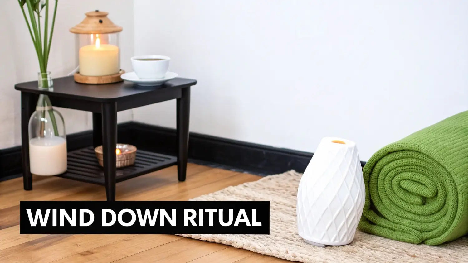 A cozy evening wind down ritual scene with a diffuser, candles, warm drink, and a soft green blanket.