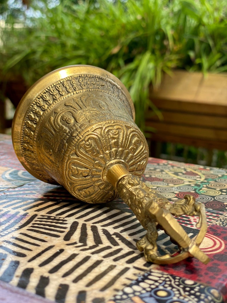 hand carving on ritual meditation bell