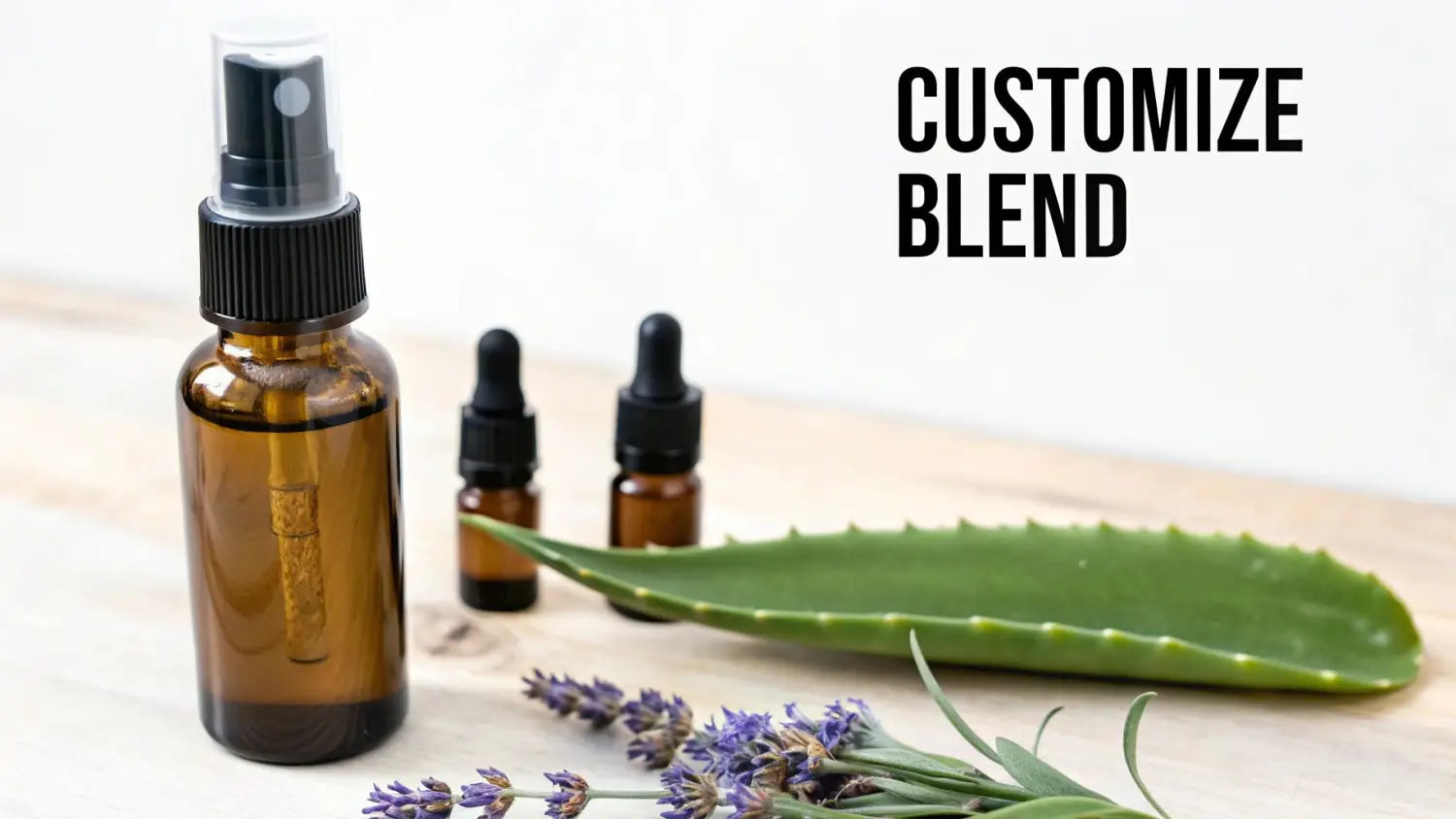 Amber spray bottle with essential oils, aloe vera leaf, and lavender for customizing blends