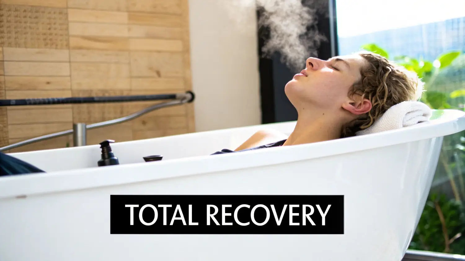 A person with eyes closed, relaxing in a steaming white bathtub with a towel for their head, symbolizing total recovery.