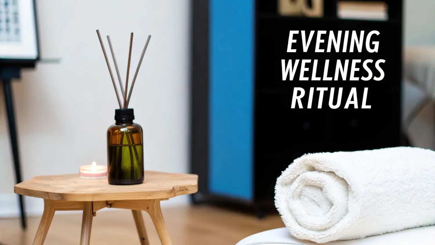 A reed diffuser and lit candle on a wooden table, with a rolled white towel and 'EVENING WELLNESS RITUAL' text.
